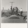 Town pump of Tulelake at railroad yard. Tulelake, Siskiyou County, California. Over 1500 people depend on hauled water for drinking the year round. During potato harvest, this pump also serves the migratory pickers. General caption number 44