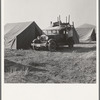 Migratory family, come to Klamath Basin for potato harvest, moving into tent in the new mobile unit. (FSA - Farm Security Administration). Tents are provided. Merrill, Klamath County, Oregon