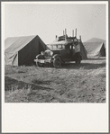 Migratory family, come to Klamath Basin for potato harvest, moving into tent in the new mobile unit. (FSA - Farm Security Administration). Tents are provided. Merrill, Klamath County, Oregon