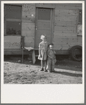 The children, seen in opening of tent in earlier photograph, before their new home. Rural shacktown. Near Klamath Falls, Oregon