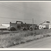 Potato sheds during season, across the road from the pickers camp. Tulelake, Siskiyou County, California. General caption number 63-11