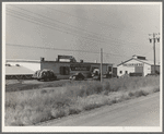 Potato sheds during season, across the road from the pickers camp. Tulelake, Siskiyou County, California. General caption number 63-11