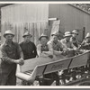 Seven of the eight farmers shown with their cooperatively owned ensilage cutter on the Miller farm, where they are working filling the silo. West Carlton, Yamhill County, Oregon. General caption number 58