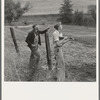 Farmer and boy in the fall of the year at the time the hunting season opens. They live in a white painted house across the road. Jackson County, Oregon