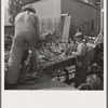Farmers feeding corn into cooperatively owned ensilage cutter. Near W Street at Carlton, Yamhill County, Oregon. General caption number 58