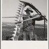 Mr. Browning in his field getting ready to mow hay. Dead Ox Flat, Malheur County, Oregon. General caption number 67-111