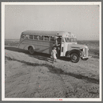 Dead Ox Flat. Children get into school bus on a fall morning. Malheur County, Oregon. General caption number 67-1V