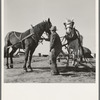 Mr. Browning prepares to go into the field to mow his hay. Dead Ox Flat, Malheur County, Oregon. General caption 67-111