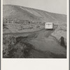 School bus starts up the flat 7:30 a.m. to collect children of new settlers. Malheur County, Oregon. General caption 67-1V