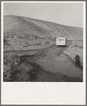 School bus starts up the flat 7:30 a.m. to collect children of new settlers. Malheur County, Oregon. General caption 67-1V