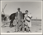 The Schroeder family on their new eighty-acre farm. Dead Ox Flat, Malheur County, Oregon. General caption number 67-111