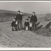 Boys wait for school bus in the morning. Malheur County, Oregon. General caption number 67-1V