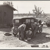 Stephens brothers, who own combine cooperatively, getting ready to go out to their lettuce field after dinner. Nyssa Heights district, Malheur County, Oregon