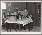 The youngest Wardlow boy copies out a recipe for his mother. Dead Ox Flat, Malheur County, Oregon