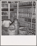 Interior of Mrs. Botner's storage cellar. 800 quarts of "food for the winter." "I miss my chickens so, but we're just not fixed for chickens or hogs yet." Nyssa Heights, Malheur County, Oregon