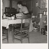 Mrs. Wardlow bakes her own bread in her dugout house. Dead Ox Flat, Malheur County, Oregon