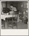 Mrs. Wardlow bakes her own bread in her dugout house. Dead Ox Flat, Malheur County, Oregon