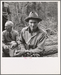 Member of the co-op in the woods. Ola self help cooperative sawmill. Gem County, Idaho. See general caption 48