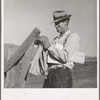 Farmer getting the morning mail. Gem County, Idaho