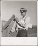 Farmer getting the morning mail. Gem County, Idaho