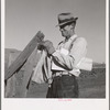Farmer getting the morning mail. Gem County, Idaho