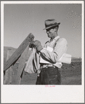 Farmer getting the morning mail. Gem County, Idaho