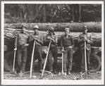 Five Idaho farmers, members of Ola self-help sawmill co-op, in the woods standing against a load of logs ready to go down to their mill about three miles away. Gem County, Idaho. General caption 48