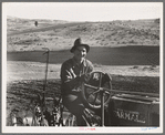 Young farmer, member of Ola self-help sawmill co-op, plowing in fall of the year. Tractor is used co-operatively. Gem County, Idaho. General caption 48