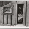Wife and baby of president of Ola self-help sawmill co-op in doorway of their home. Gem County, Idaho. General caption 48