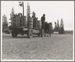 Farmer and his boy hauling water for drinking and domestic purposes to the stump farm. Boundary County, Idaho. General caption 53