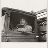 Stump farmer hauling load of slab wood for sale in town. Bonner County, Idaho. See general caption 49