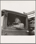 Stump farmer hauling load of slab wood for sale in town. Bonner County, Idaho. See general caption 49