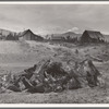 Stump pile, ready to burn, house, barn, and farm buildings on Unruf farm. Boundary County, Idaho. See general caption 52