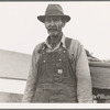 Stump farmer comes to town on a Saturday morning to bring in cream and do the shopping. Bonners Ferry, Idaho