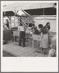 Portable laundry unit, shower unit beyond. FSA (Farm Security Administration) camp, Merrill, Oregon. See general caption 62