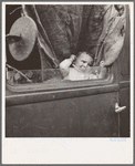 Baby from Mississippi parked in truck at FSA (Farm Security Administration) camp, Merrill, Oregon. See general caption 62