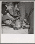 The doctor examines the boy from Texas. In mobile unit of FSA (Farm Security Administration) camp, Merrill, Klamath County, Oregon. See general caption 62