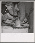 The doctor examines the boy from Texas. In mobile unit of FSA (Farm Security Administration) camp, Merrill, Klamath County, Oregon. See general caption 62