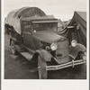 Truck, baby parked on front seat. Merrill, Klamath County, Oregon, in FSA (Farm Security Administration) camp