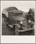 Truck, baby parked on front seat. Merrill, Klamath County, Oregon, in FSA (Farm Security Administration) camp