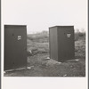 Twenty-four portable toilets, mobile camp (FSA - Farm Security Administration) equipment. Merrill, Klamath County, Oregon