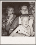 Family of six in tent after supper. Came to potato harvest after father was laid off of WPA (Work Projects Administration) in Boise, Idaho. Oldest child is twelve. Little boy has dysentery. Merrill, Klamath County, Oregon