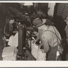 In packing shed, grading and sacking potatoes in twenty-five pound sacks for the chain store trade. Tulelake, Siskiyou County, California