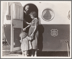 Young mother brings her child to the trailer clinic on the day when the doctor will be in camp to examine some of the children. Klamath County, Oregon. FSA (Farm Security Administration) camp