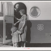 Young mother brings her child to the trailer clinic on the day when the doctor will be in camp to examine some of the children. Klamath County, Oregon. FSA (Farm Security Administration) camp