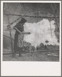 Method of scraping hide for softening. Indian fishing village. Oregon