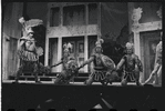 Ron Holgate and unidentified others in the 1962 stage production A Funny Thing Happened on the Way to the Forum