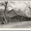 Tool and machine shed on W.H. Cox farm, Clearcreek Township, Johnson County, Iowa. Note how the buildings are propped up. This is an owner-operated farm of one hundred twenty-four acres, sixty of which are tillable