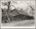 Tool and machine shed on W.H. Cox farm, Clearcreek Township, Johnson County, Iowa. Note how the buildings are propped up. This is an owner-operated farm of one hundred twenty-four acres, sixty of which are tillable