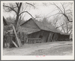 Tool and machine shed on W.H. Cox farm, Clearcreek Township, Johnson County, Iowa. Note how the buildings are propped up. This is an owner-operated farm of one hundred twenty-four acres, sixty of which are tillable